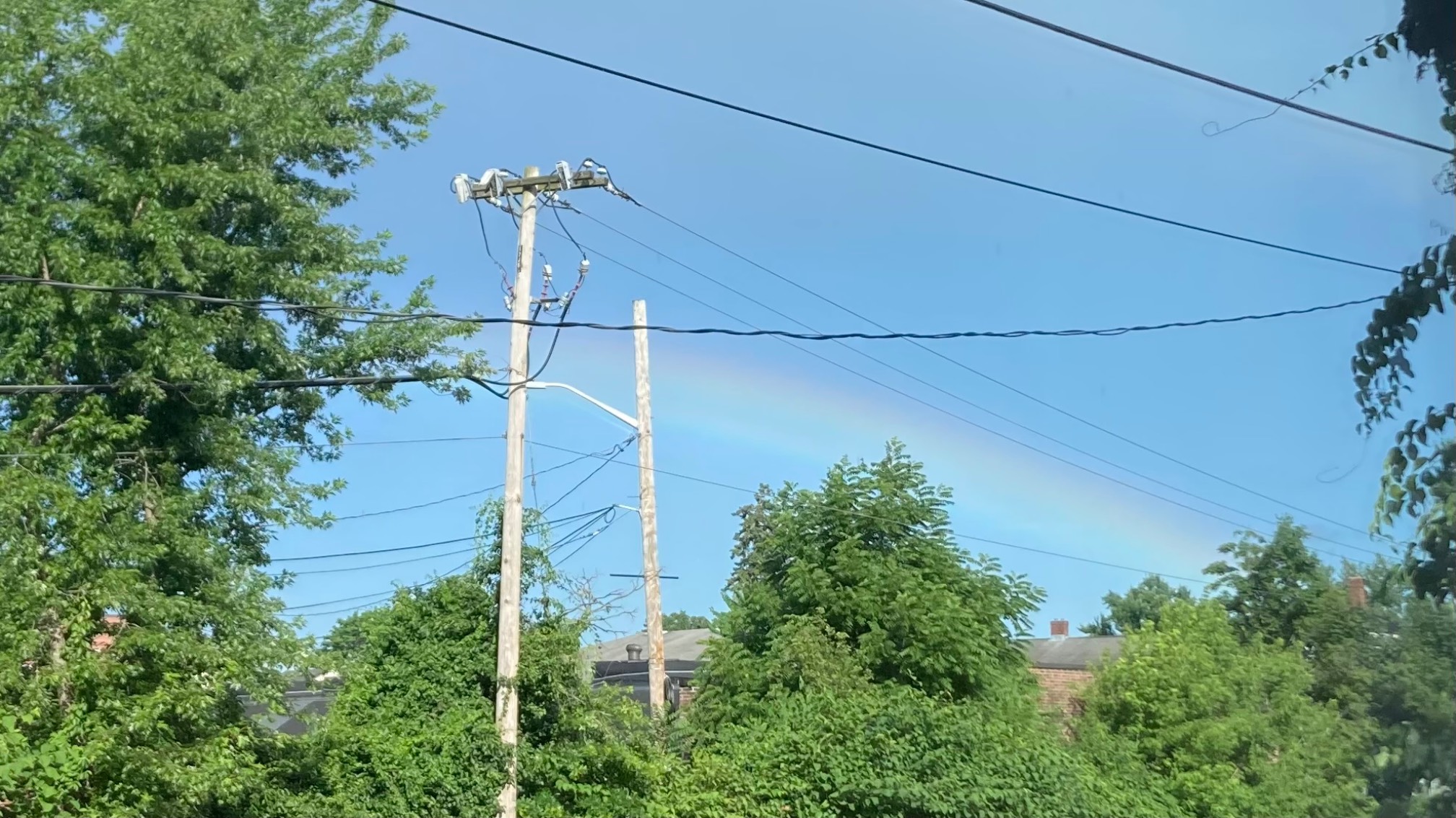 Sun rain, mildly supernumerary rainbow.
