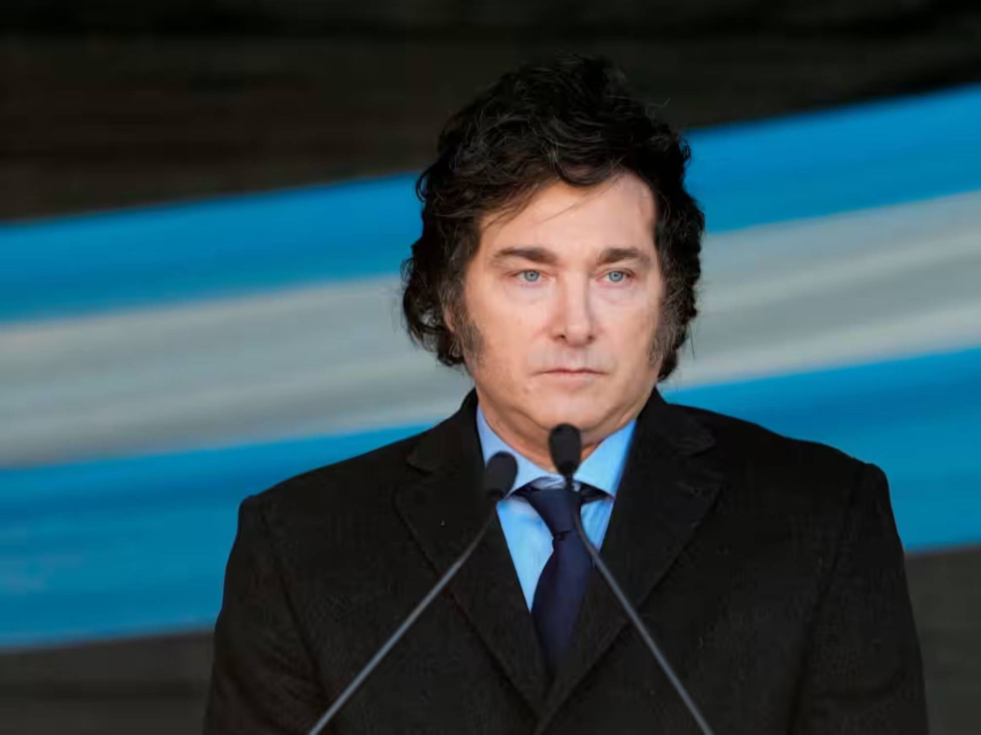 Javier Milei at a microphone