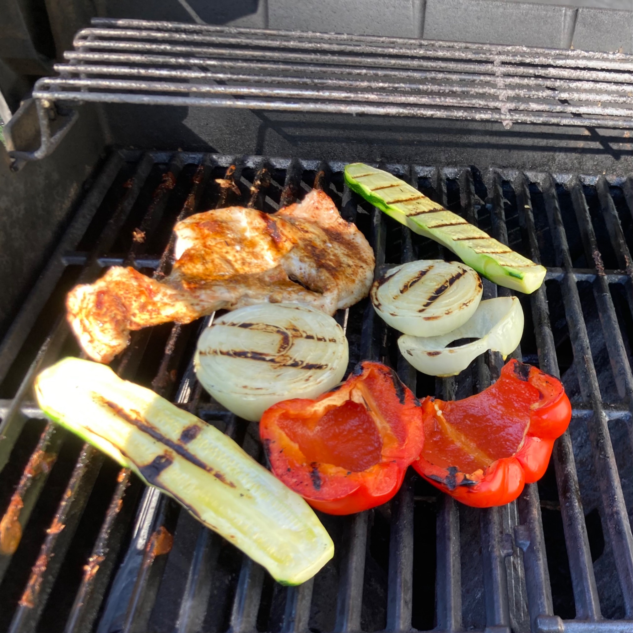 Zucchini, pepper, onions, and chicken on grill
