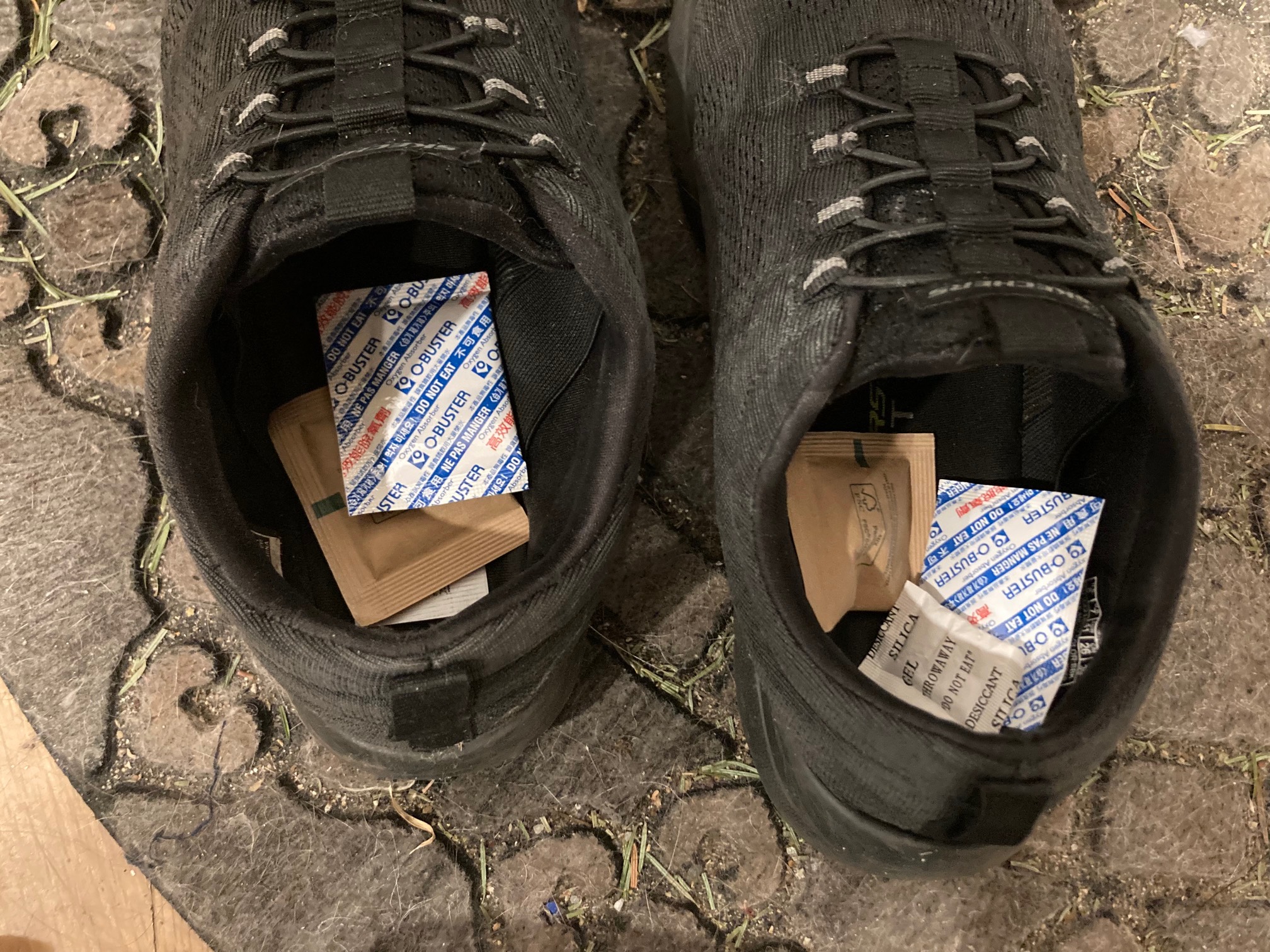 Pair of shoes with three silica gel packets in each