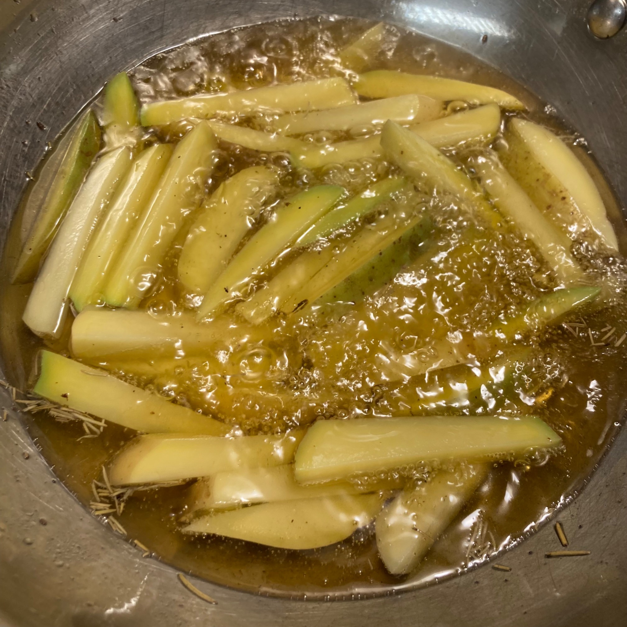 These will either be rosemary-flavored fries or fries with bits of burnt rosemary.