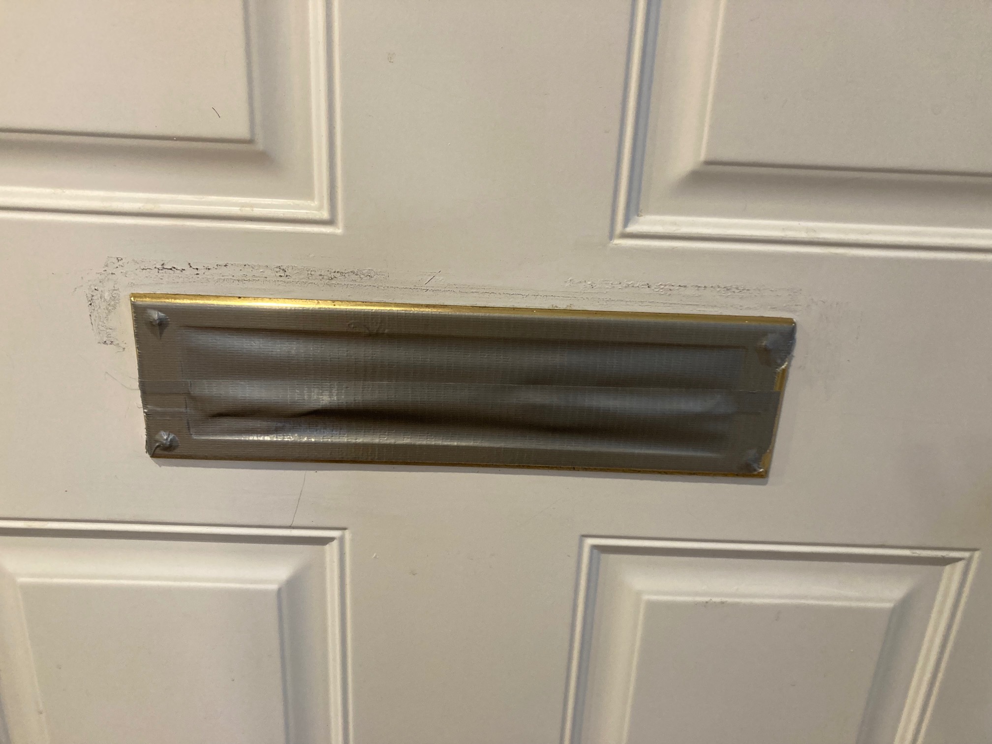 Duct tape over mail slot
