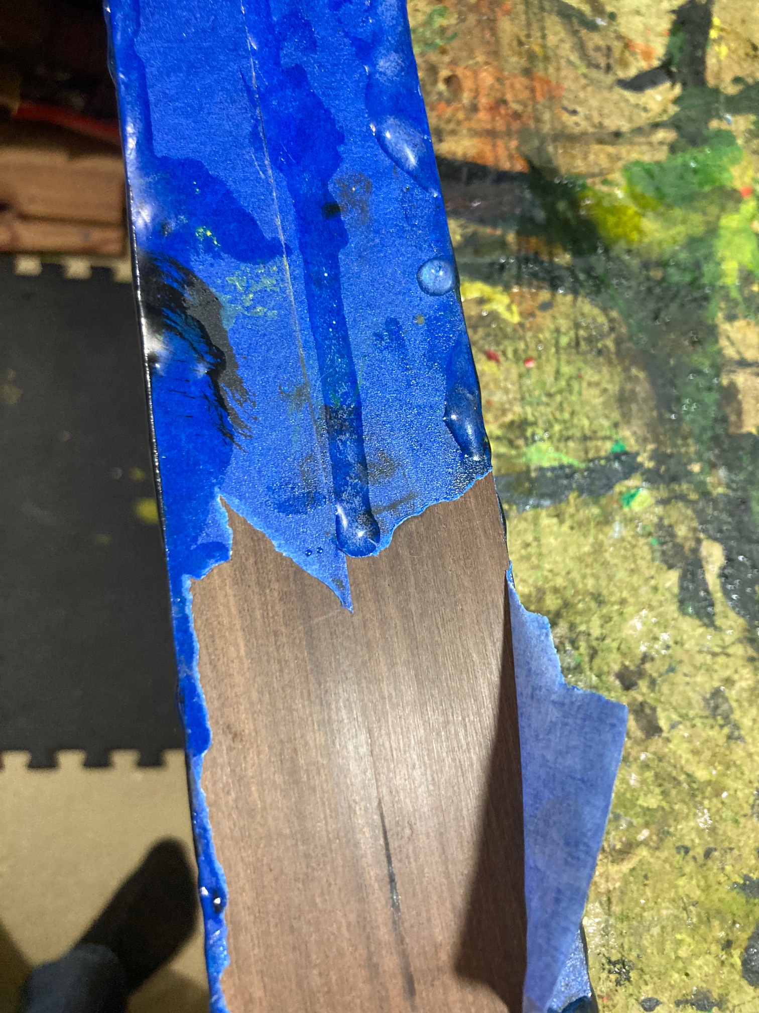 It turns out that epoxy can soak through painter’s tape. Fortunately, it doesn’t bind to the surface