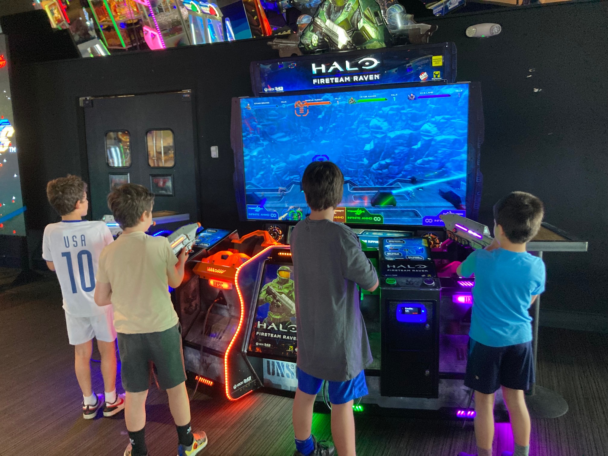 Kids playing Halo-branded gun arcade game