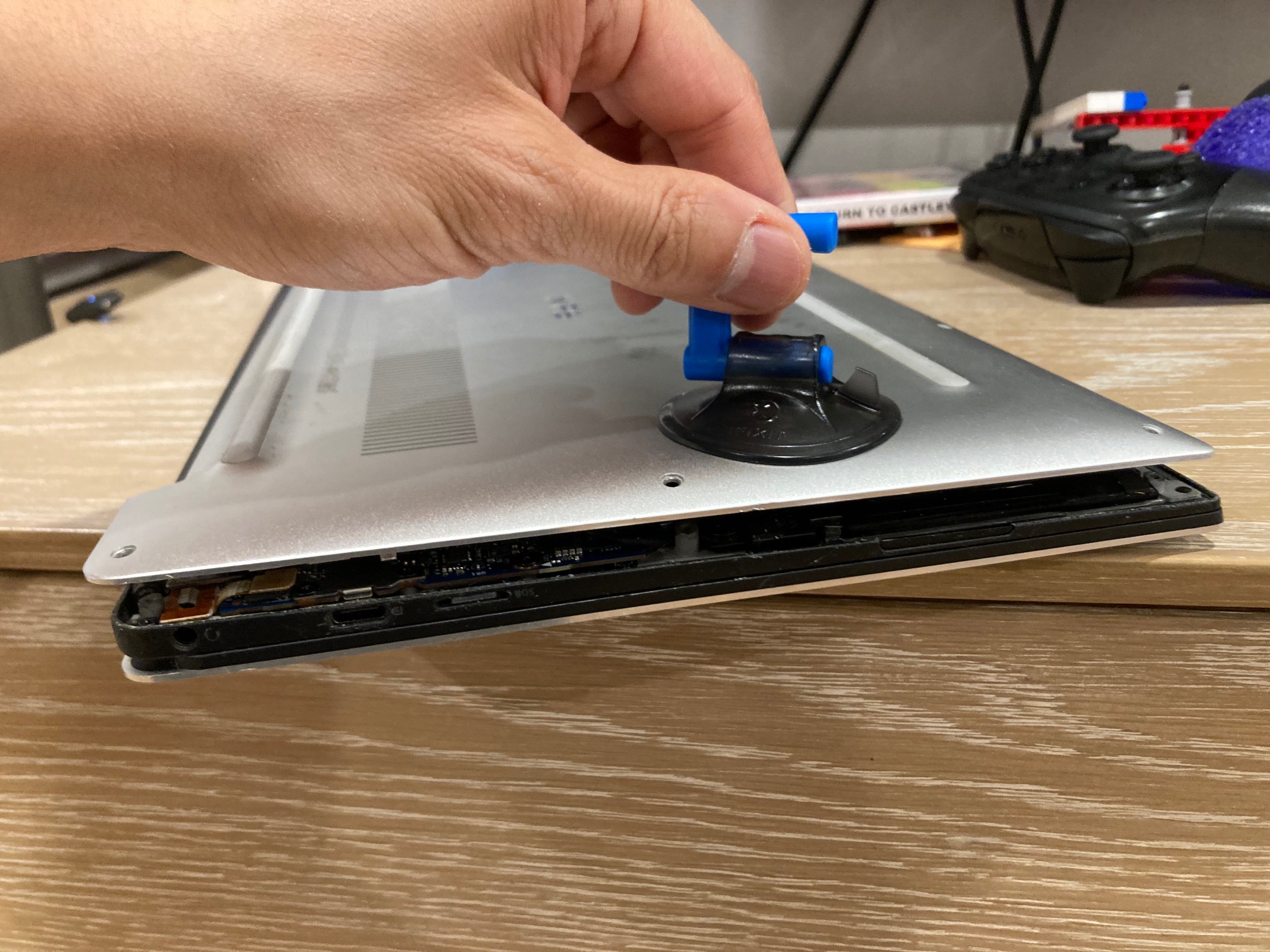 Suction cup attached to a laptop case 