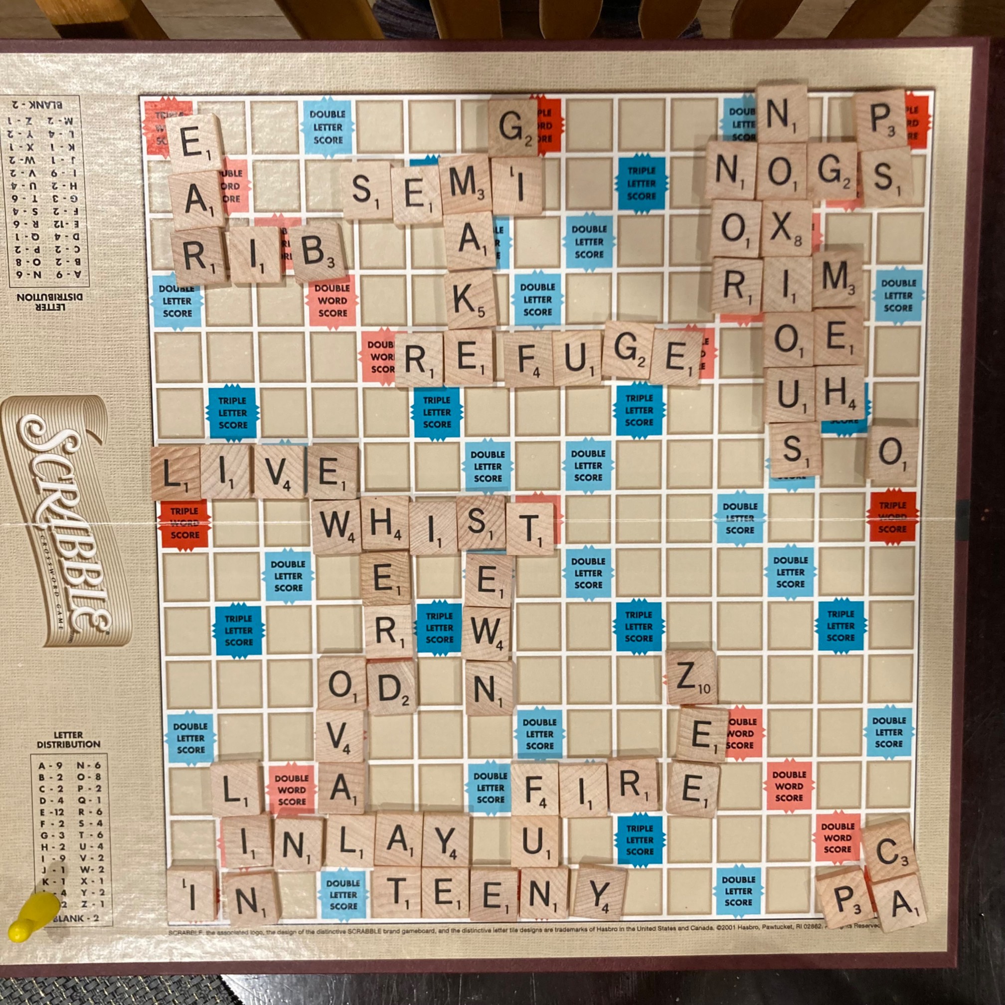 The guy read a suggestion in Math Games with Bad Drawings to play Scrabble with a rule allowing Pac-