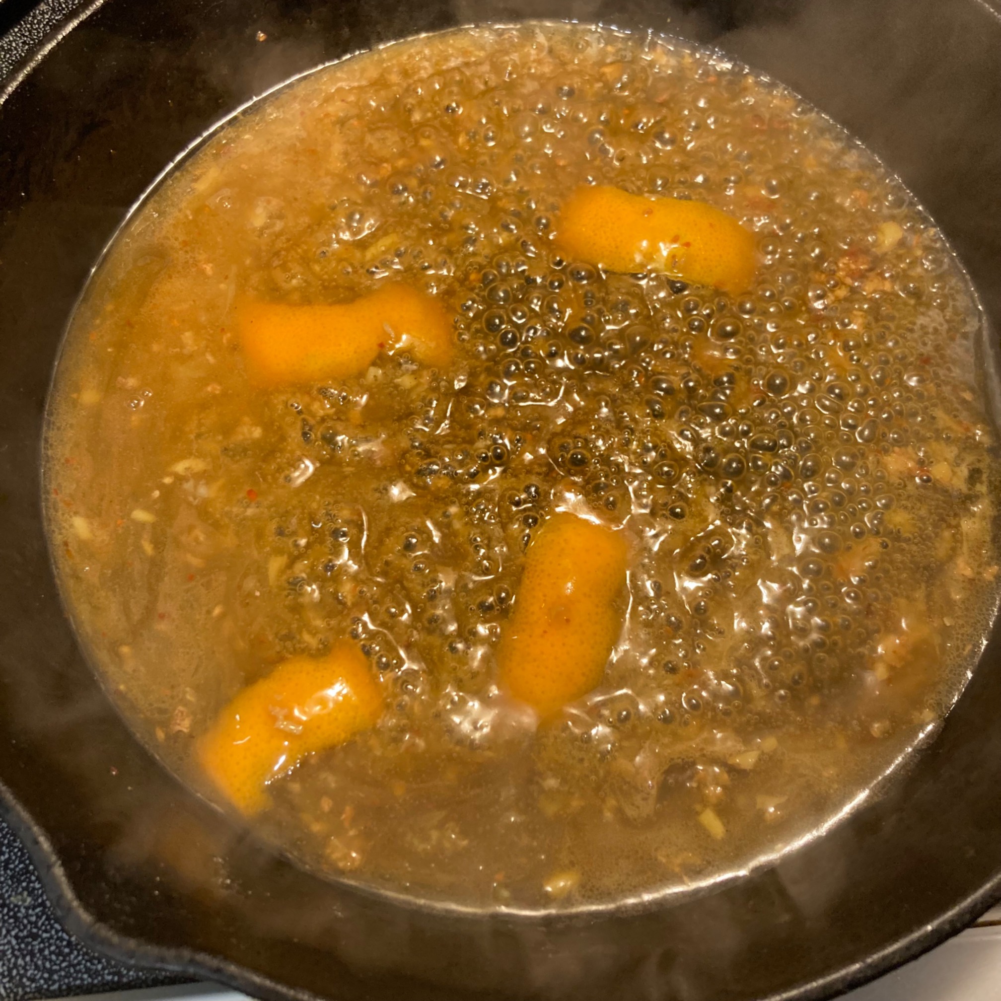 Orange sauce in pan