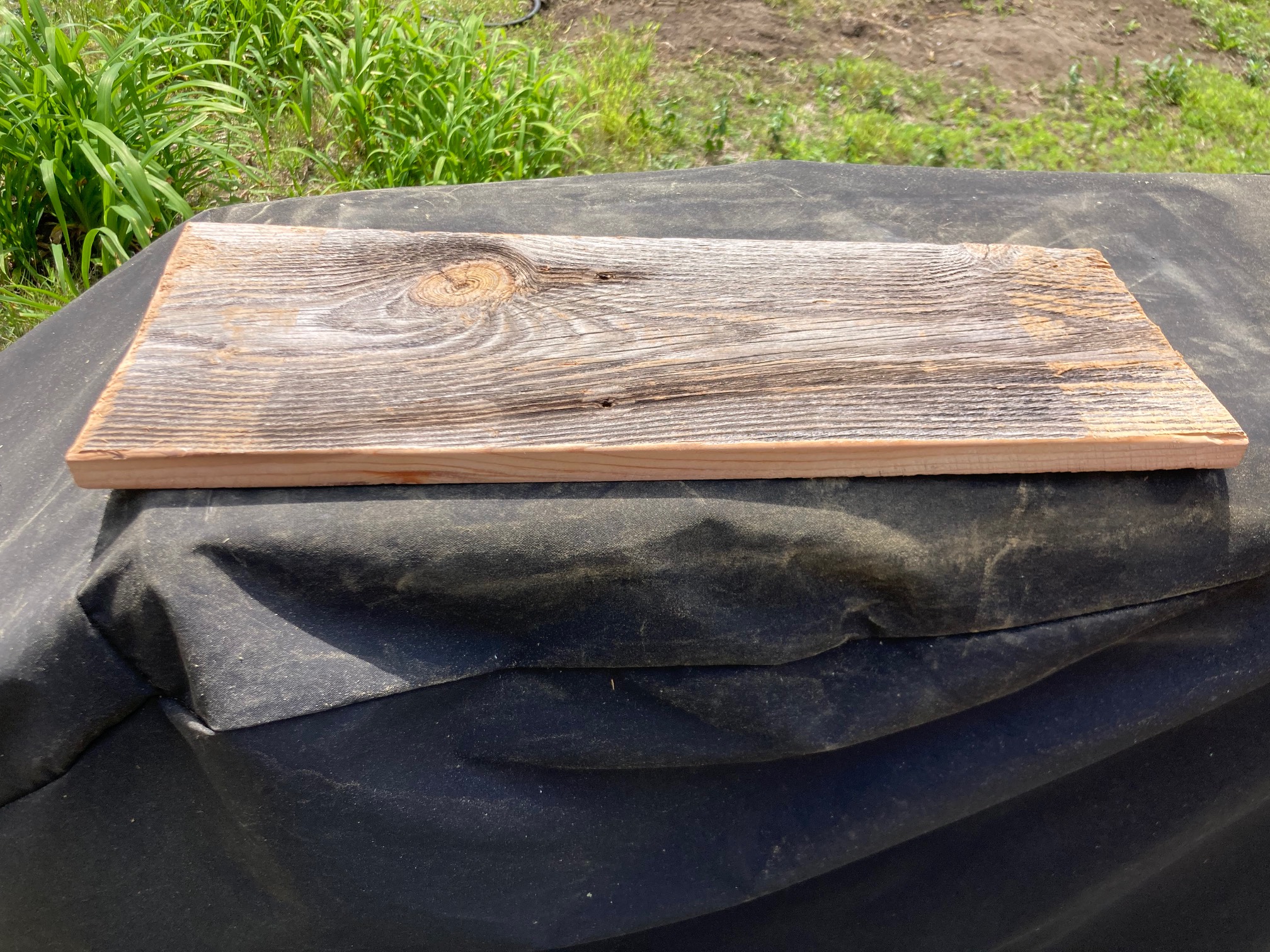 Board with rippled gray surface