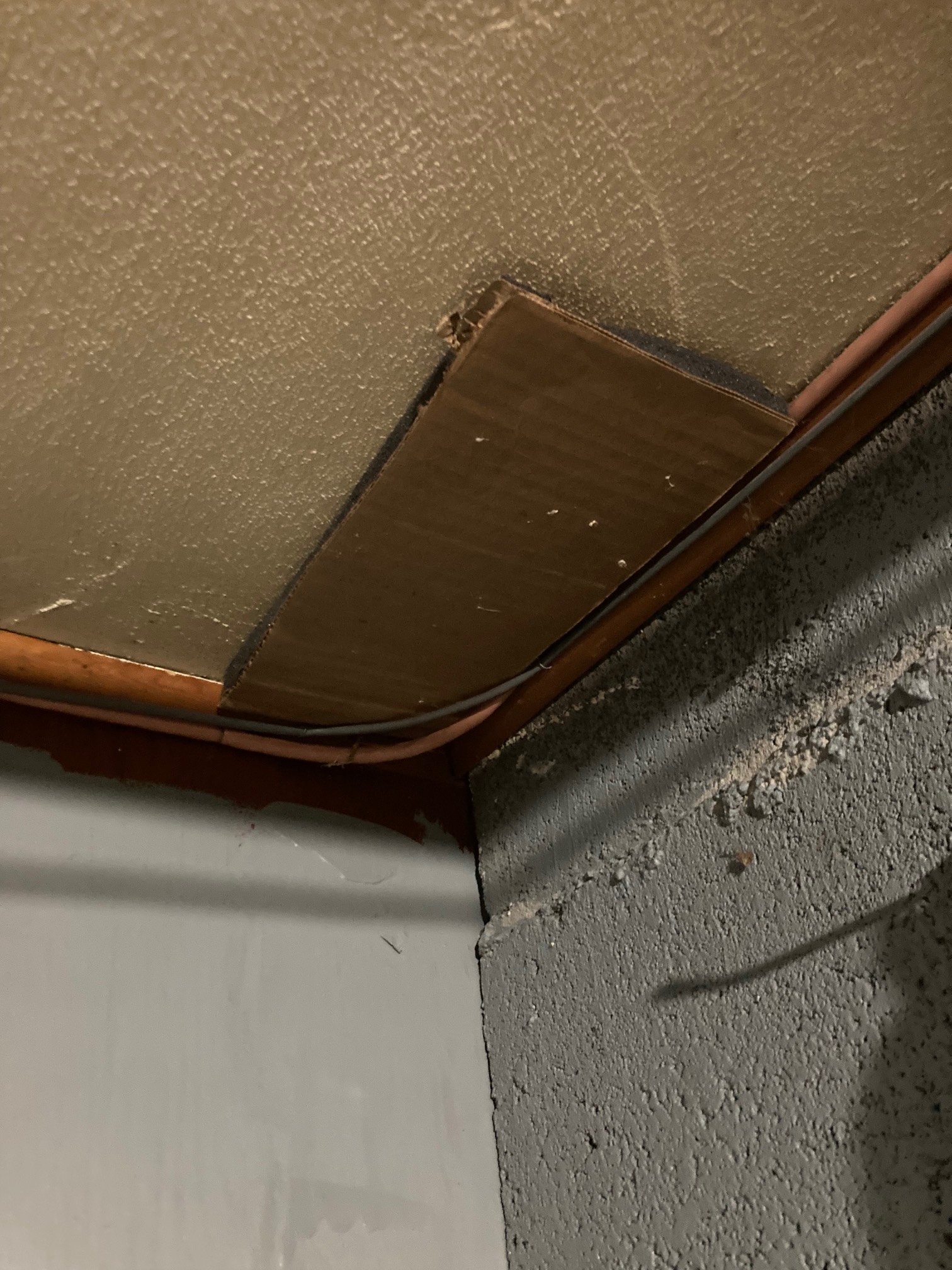 Patched this hole with double-sided tape and insulation tape (we’re out of duct tape) and cardboard 