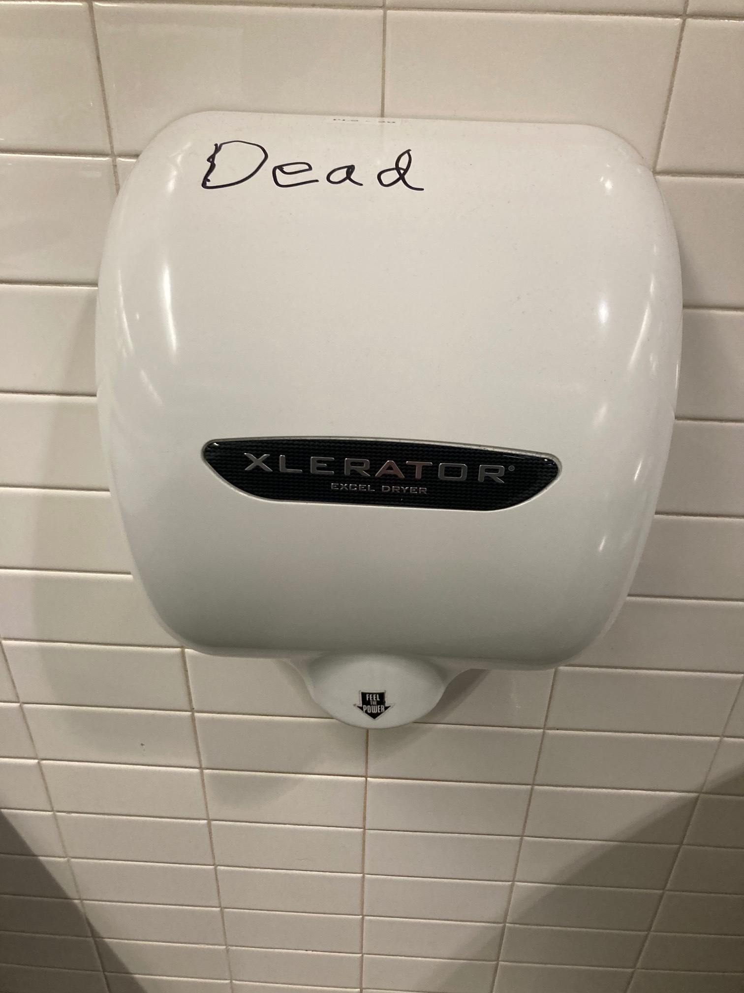 Hand dryer with “dead” written on it