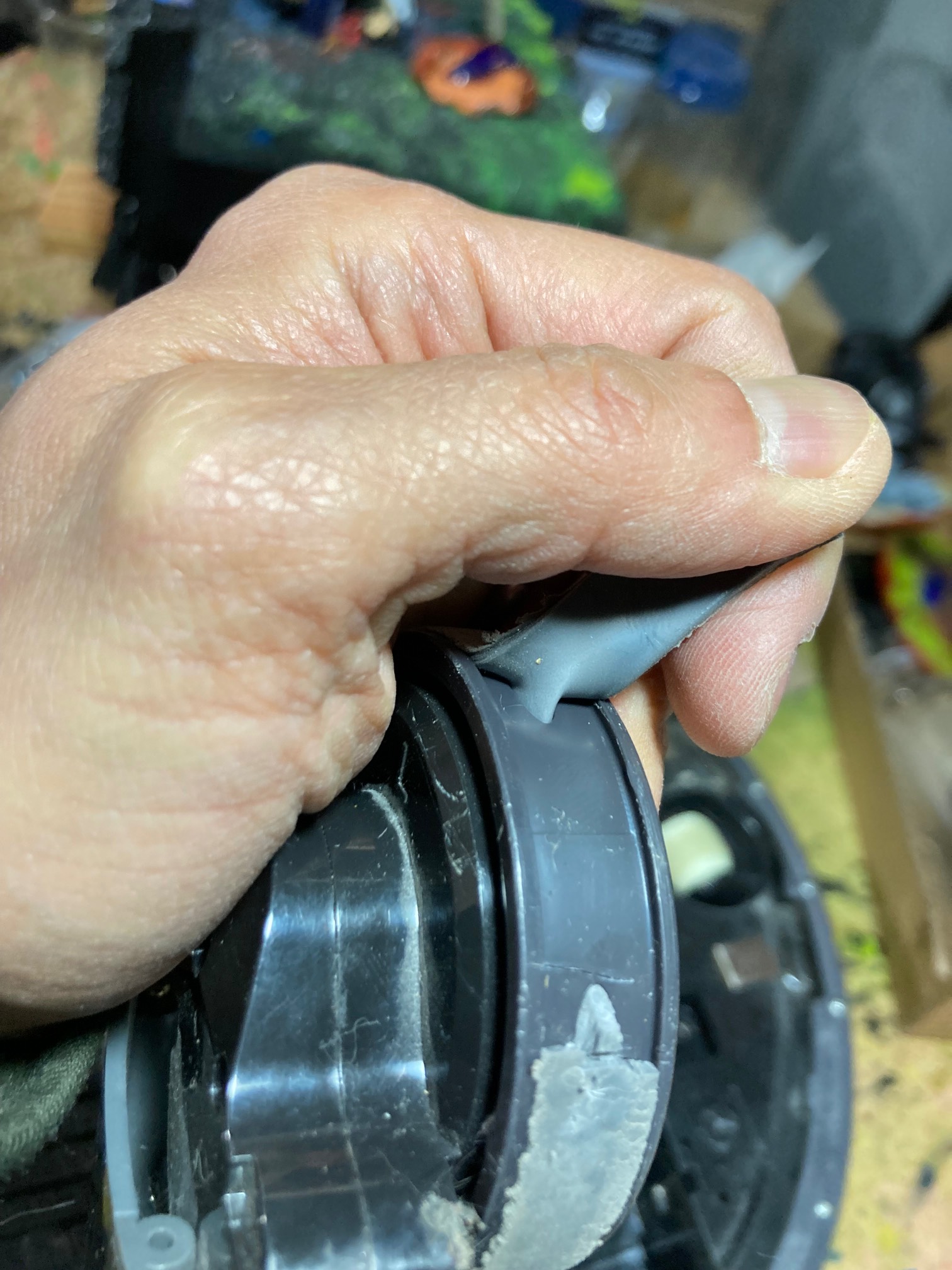 Rubber tire with tendril stuck in wheel notch