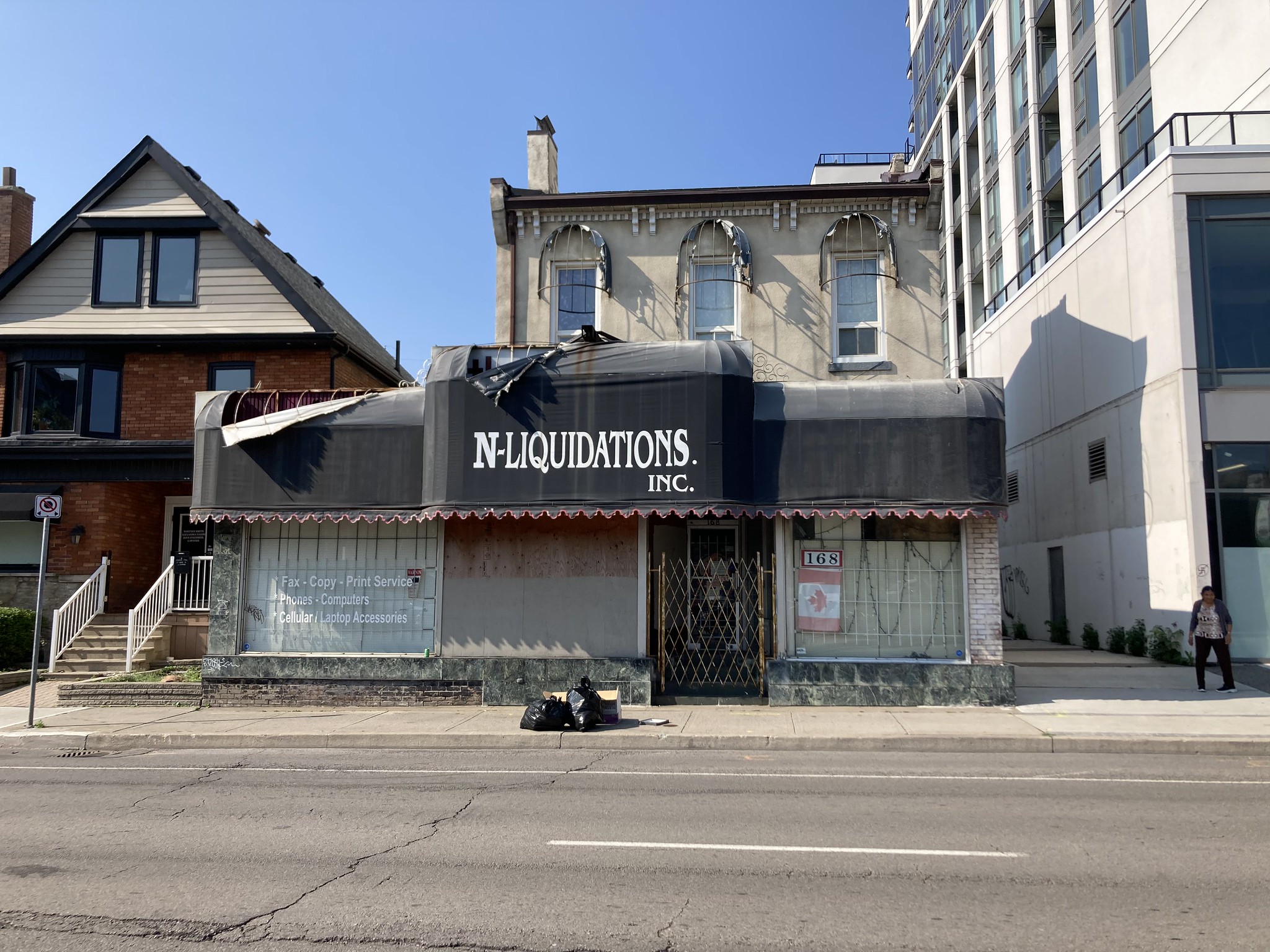Storefront with torn awnings