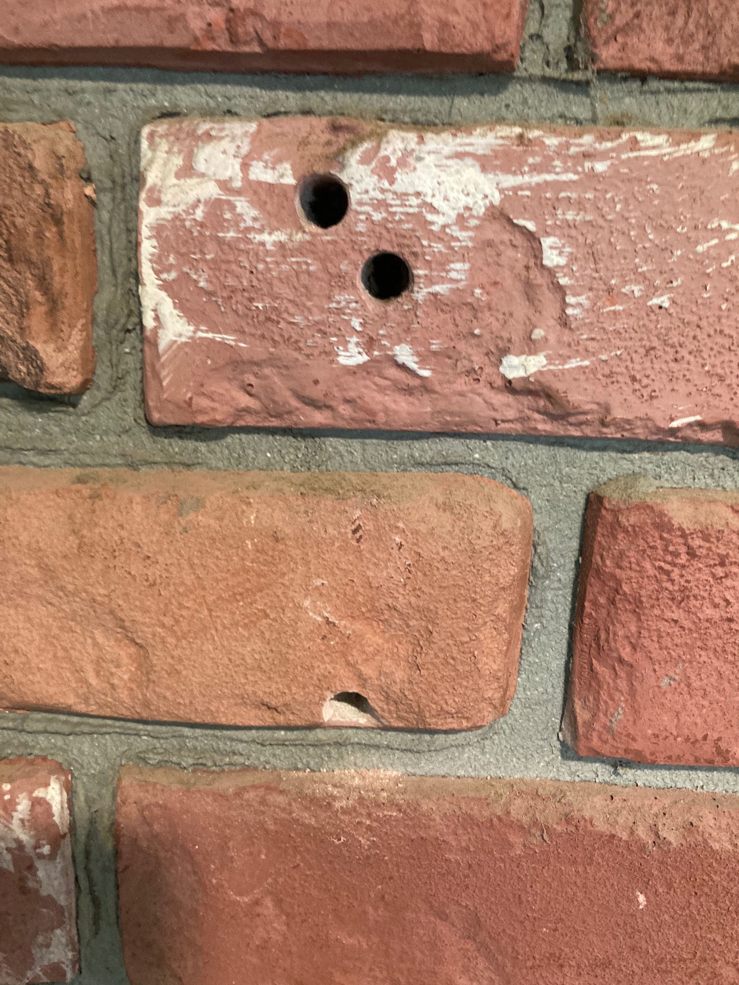 Brick with two holes in it