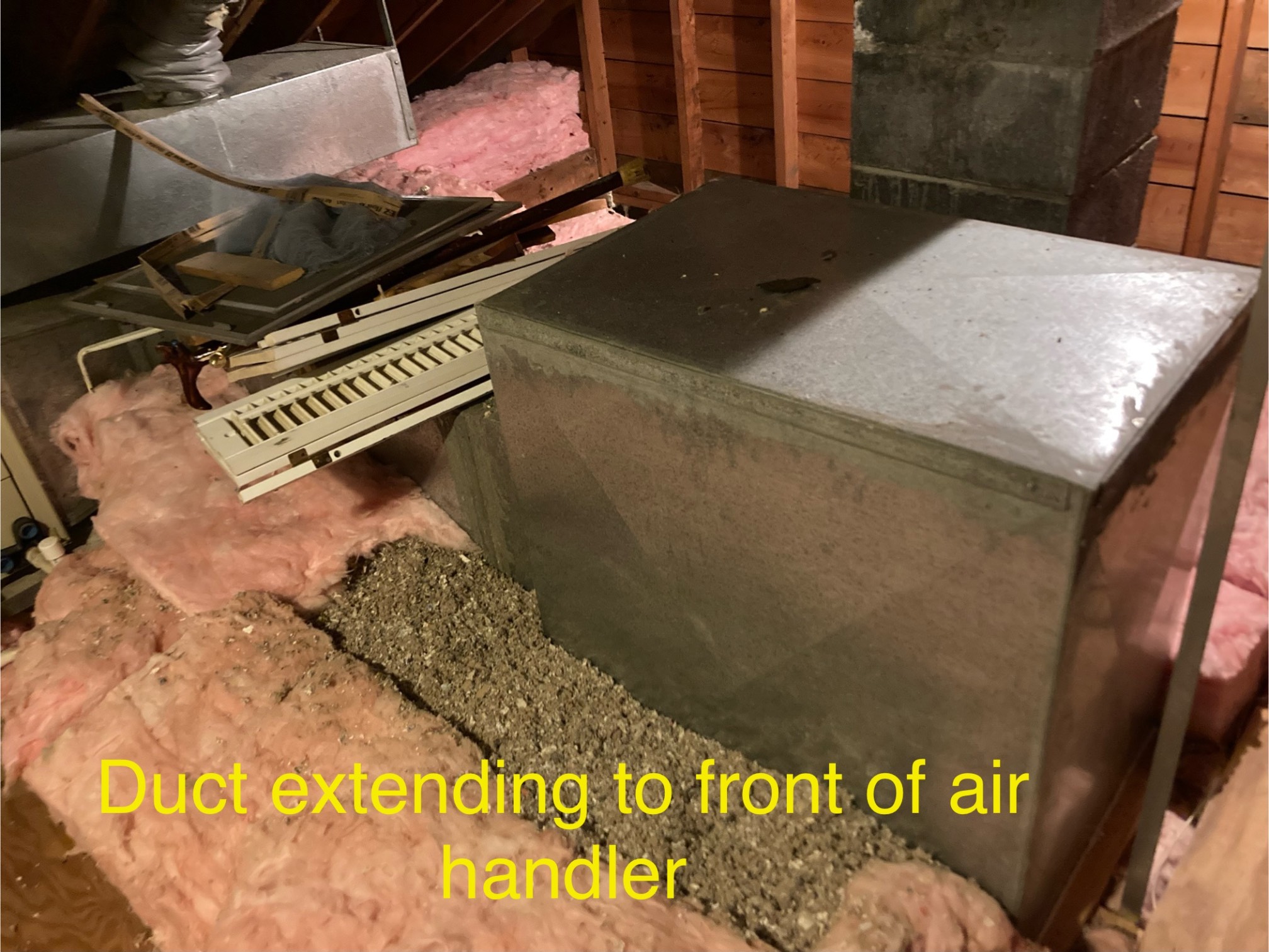 AC duct in attic with insulation