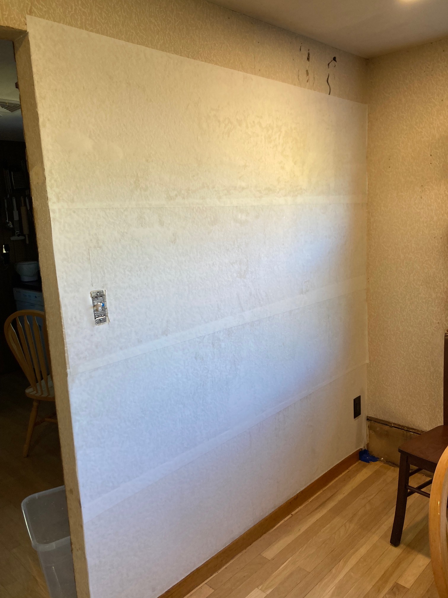 Wall with four strips of wall liner 