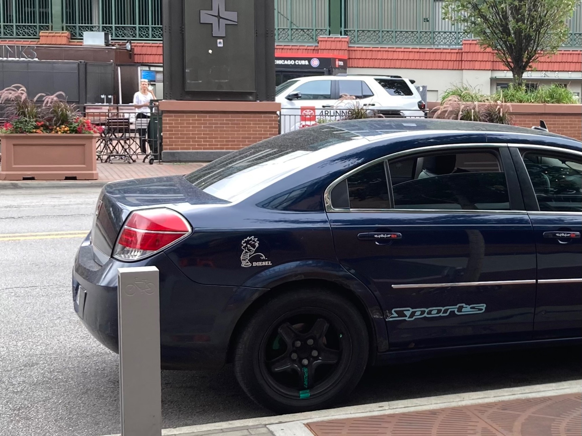 Car with Calvin pissing sticker and “sport” sticker