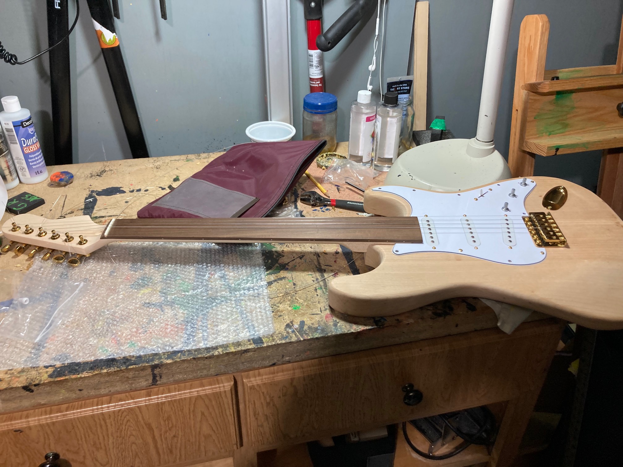 After a ton of loosening the truss rod, I got the fingerboard to be flat enough to be able to play w