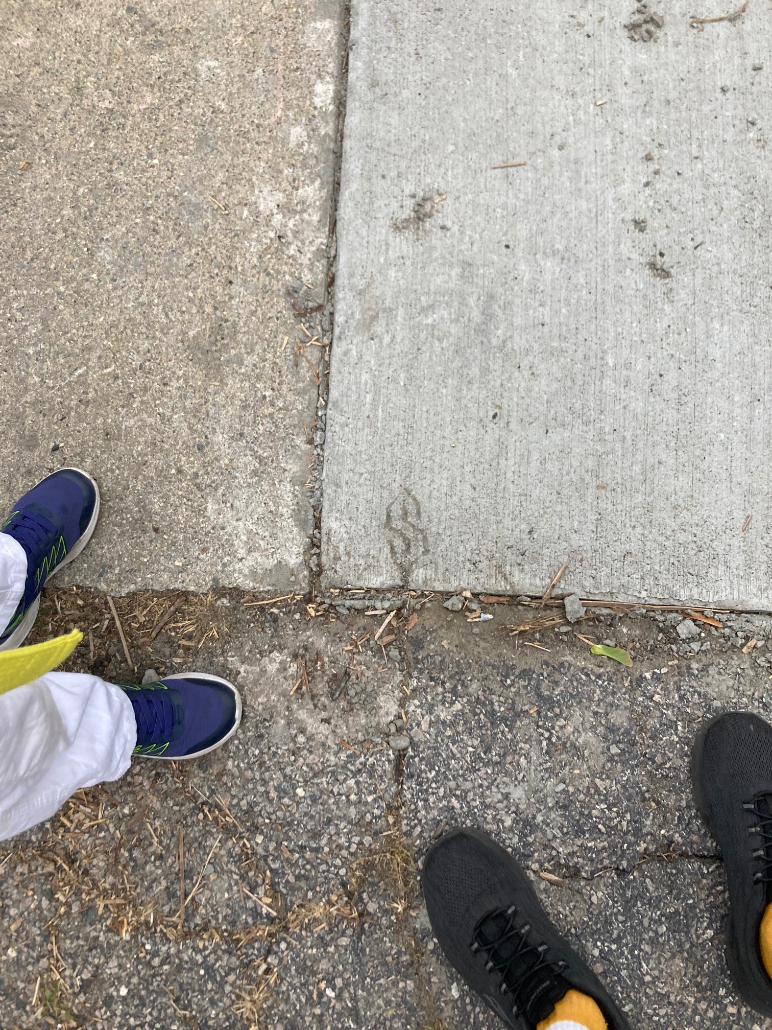 Cool S etched in sidewalk