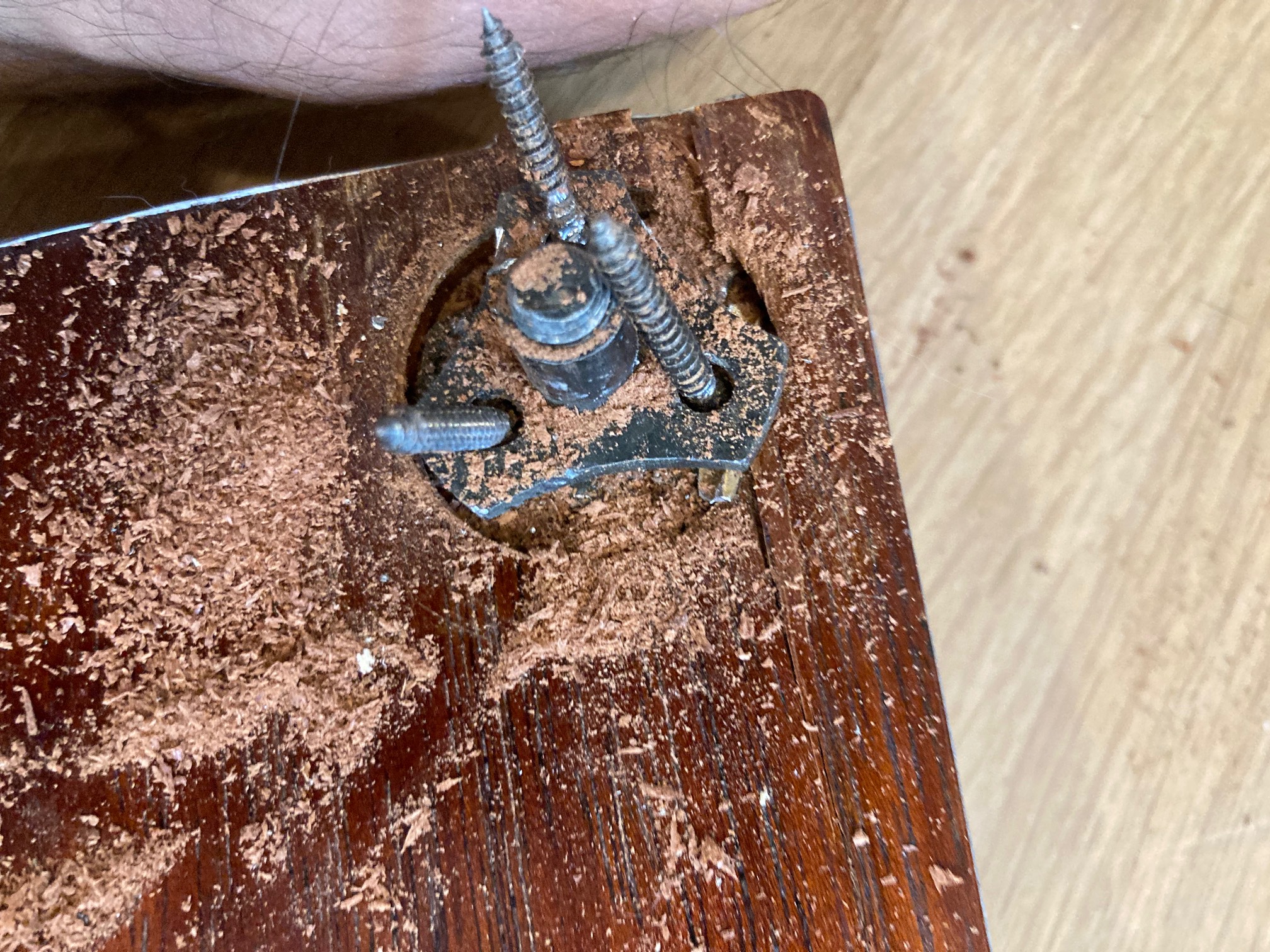 Yup. Metal plate. I shoulda looked before I drilled.