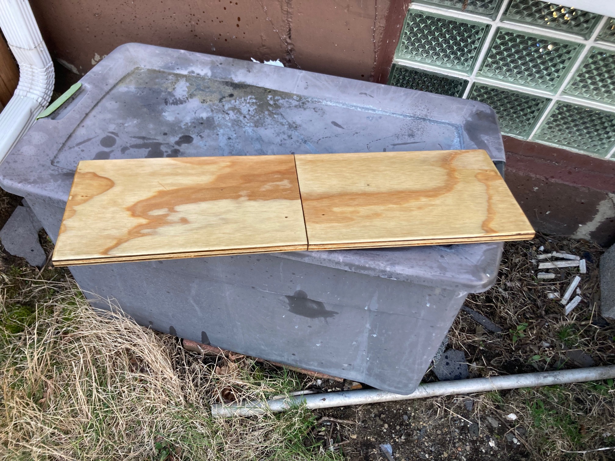 Darker plywood on plastic tub