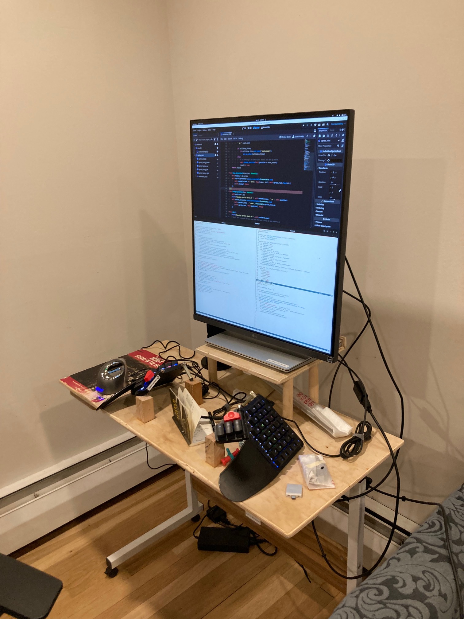 Small desk with very large monitor on it