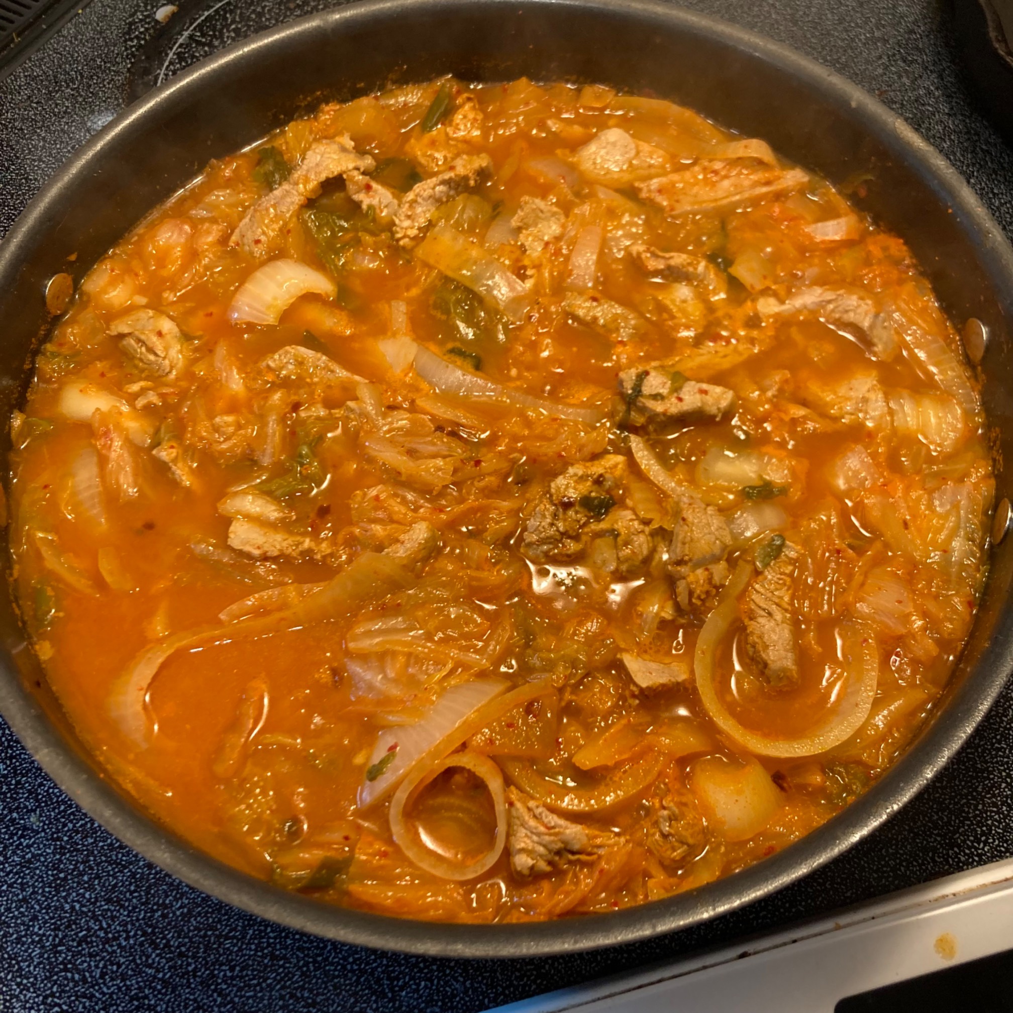 Orange stew in deep pan