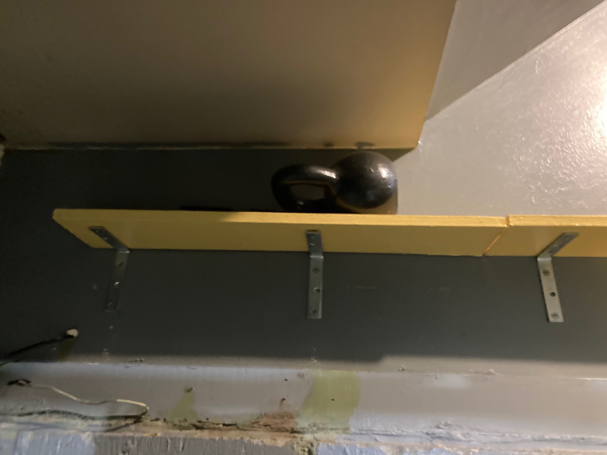 Shoe shelf with 30 lb. weight on it