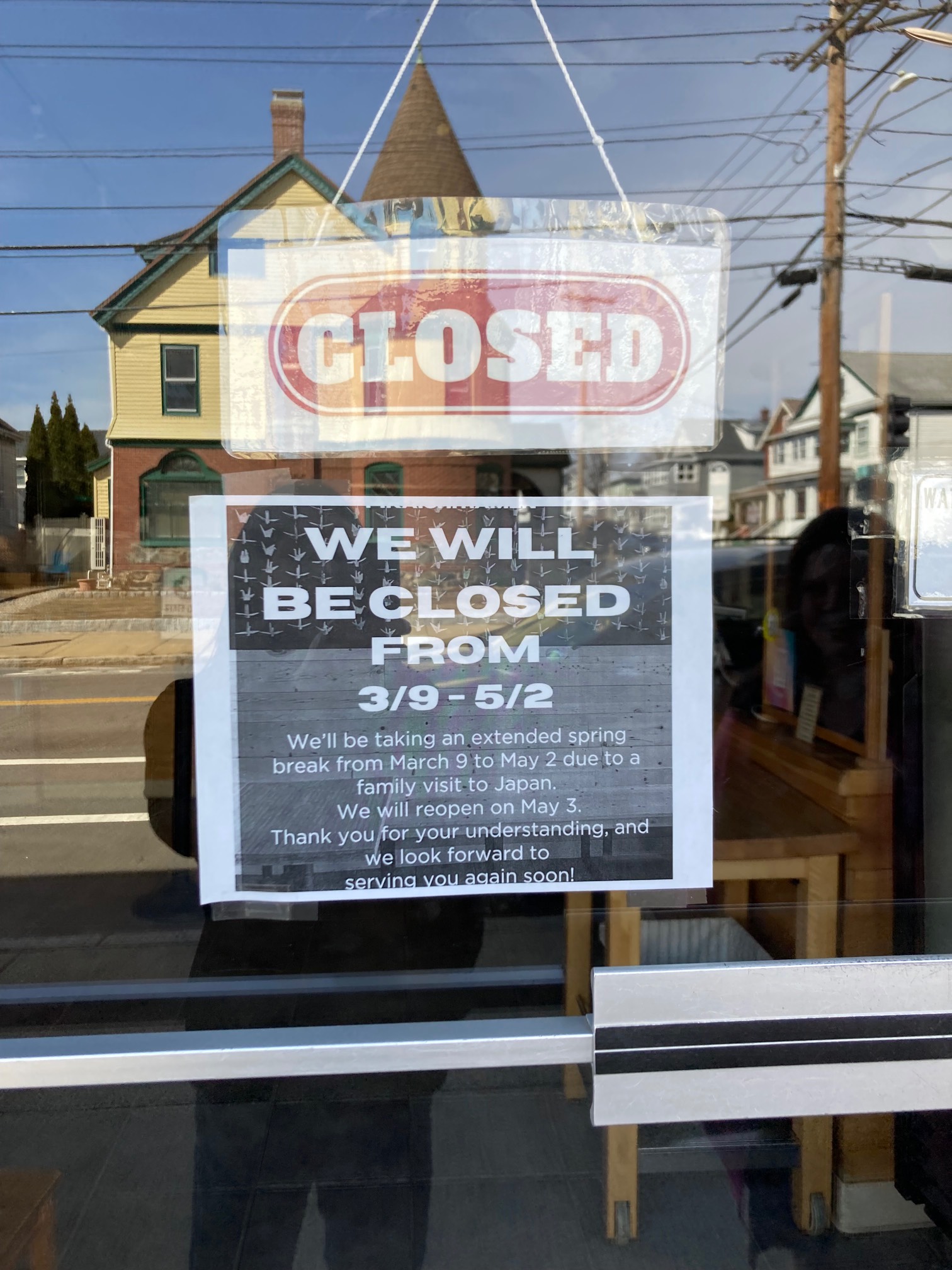 Sign reading “WE WILL BECLOSER FROM 3/9 - 5/2 We'll be taking an extended spring break from March 9 to May 2 due to a family visit-to Japan. We will reopen on May 3 Thank you for your understanding, and we look forward to serving you again soon.”
