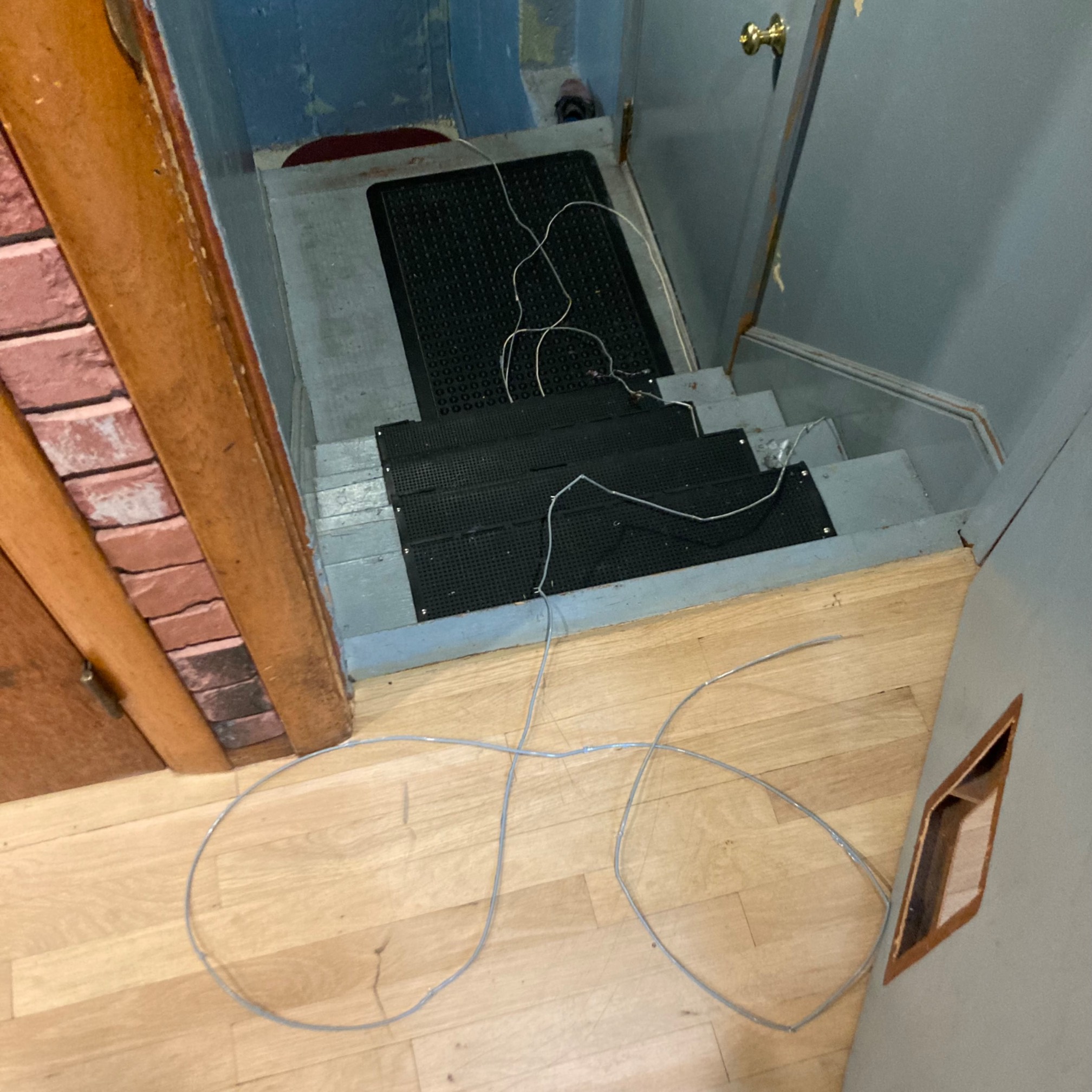 Stairway with dislodged wiring on it