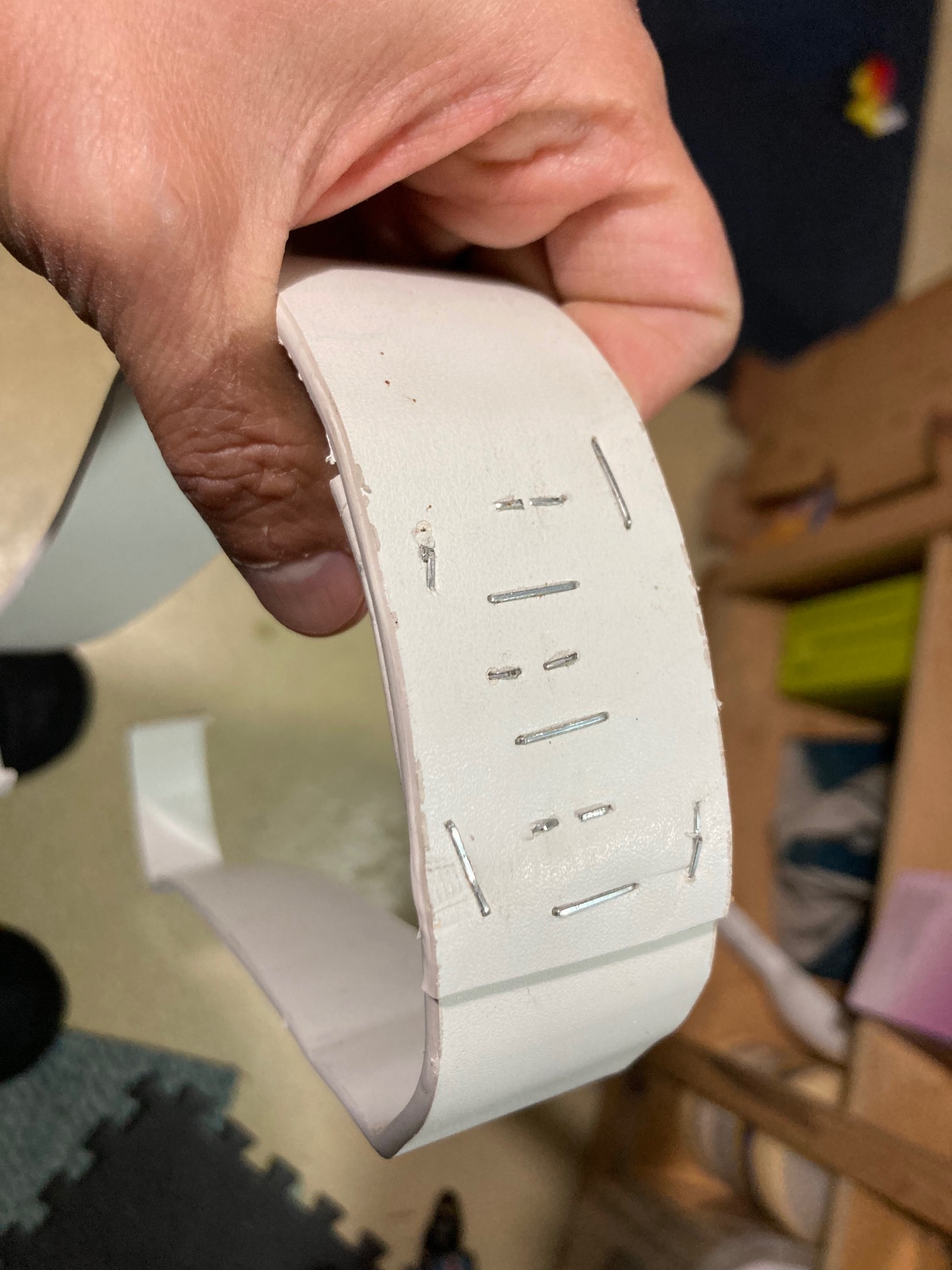 Strips of plastic with staples connecting them